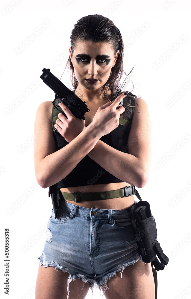 Dangerous female killer with a gun. Beautiful shapely woman. Specific makeup Dangerous female killer with a gun. Beautiful shapely woman. Specific makeup