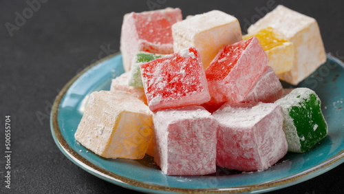 Assorted Turkish delights Rahat lokum. Colorful cubes of Turkish delights. Ramadan bayrami (eid al fitr) and Kurban bayrami (eid al adha) background photo.