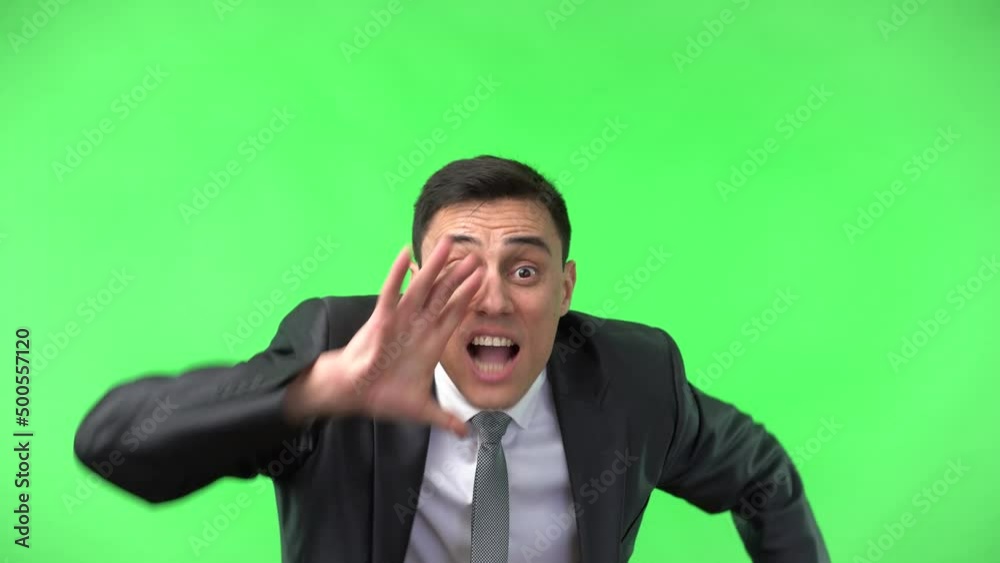 Excited handsome man talking shocking secret news Excited handsome man talking shocking secret news