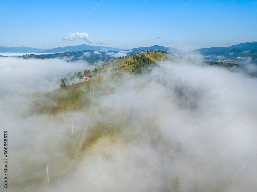Obraz premium Morning fog in the Ukrainian Carpathians. Aerial drone view.