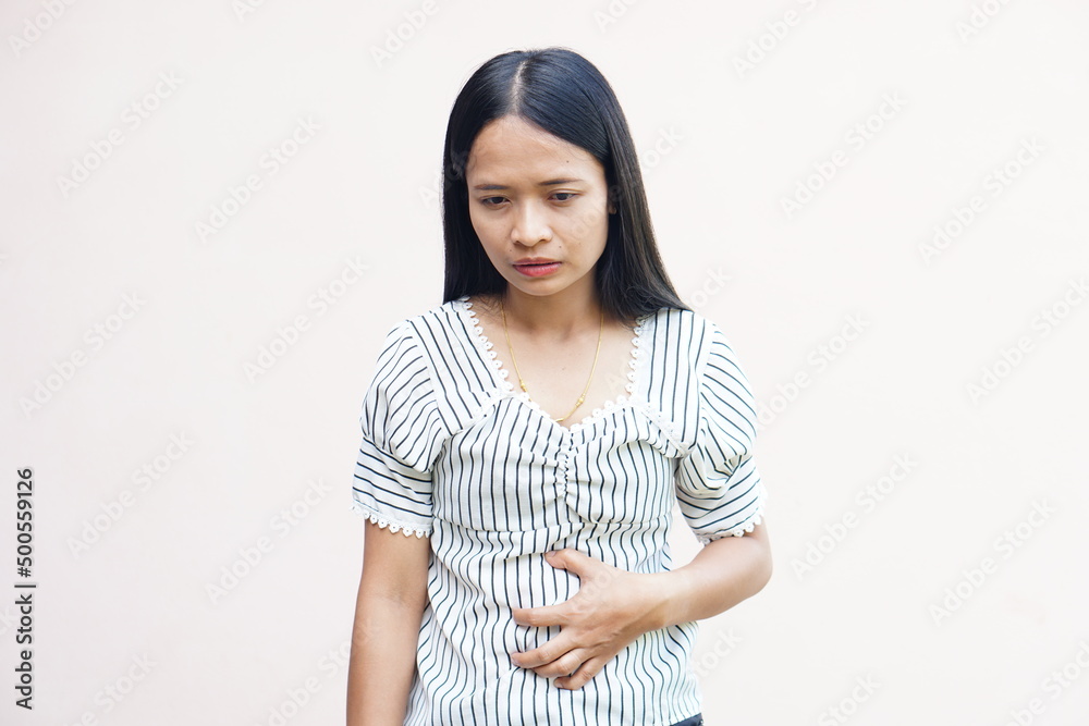Woman suffer from stomachacheChronic gastritis Abdomen bloating concept Woman suffer from stomachacheChronic gastritis Abdomen bloating concept