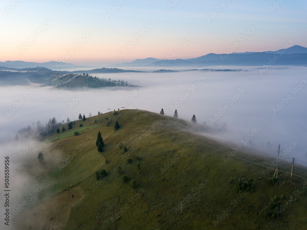 Morning fog in the Ukrainian Carpathians. Aerial drone view.