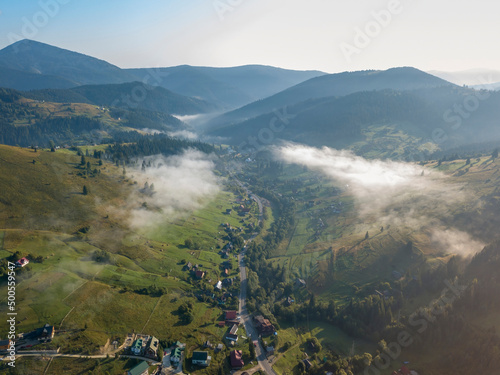 Ukrainian Carpathians mountains on a summer morning. Aerial drone view. © Sergey