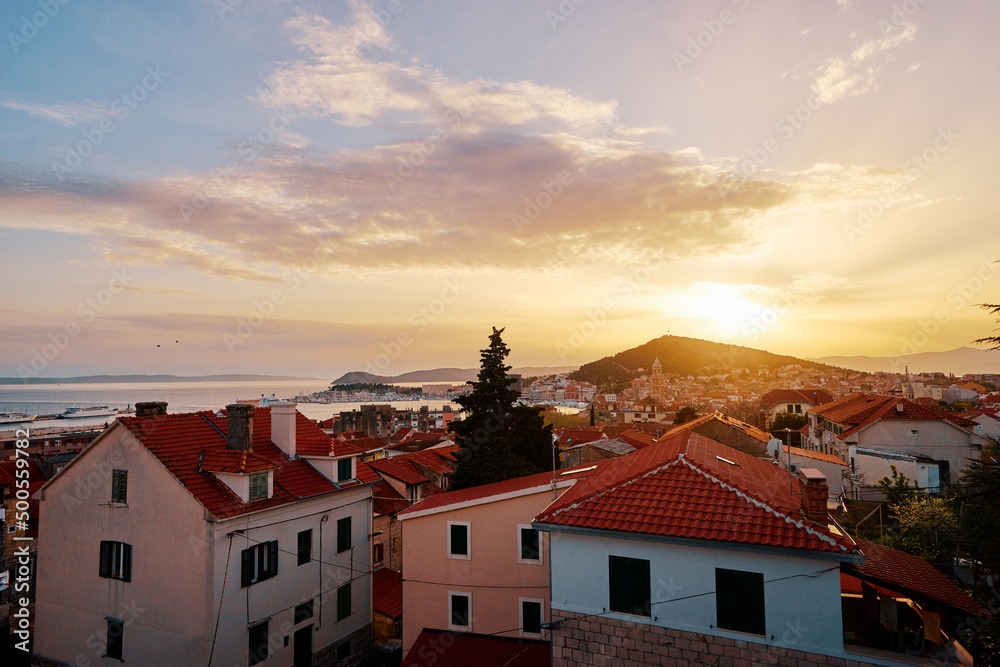 Beautiful sunset cityscape with red tiled roofs of Split old town, Croatia.
