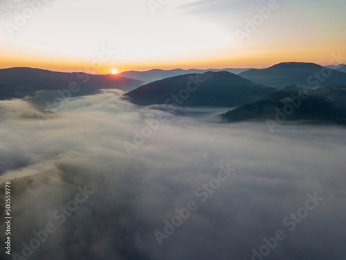 Sunrise over the fog in the Ukrainian Carpathians. Aerial drone view. © Sergey