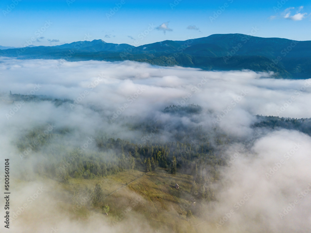 Foggy summer morning in the Ukrainian Carpathians. Aerial drone view.