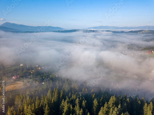 Morning mist in Ukrainian Carpathian mountains. Aerial drone view.