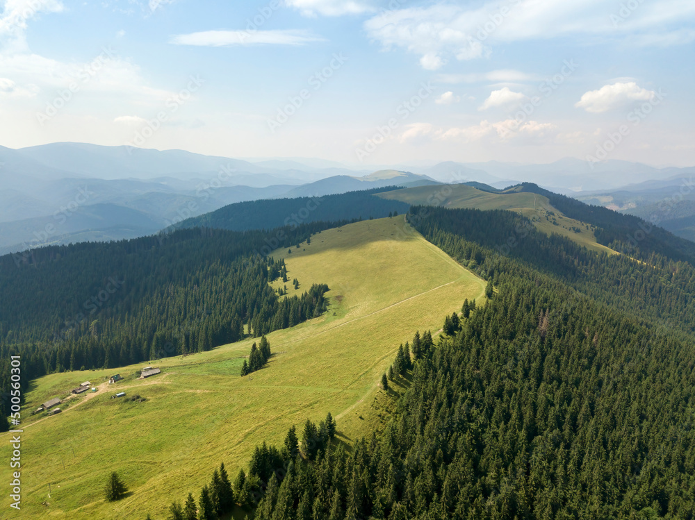 Green mountains of Ukrainian Carpathians in summer. Sunny day, rare clouds. Aerial drone view. Green mountains of Ukrainian Carpathians in summer. Sunny day, rare clouds. Aerial drone view.