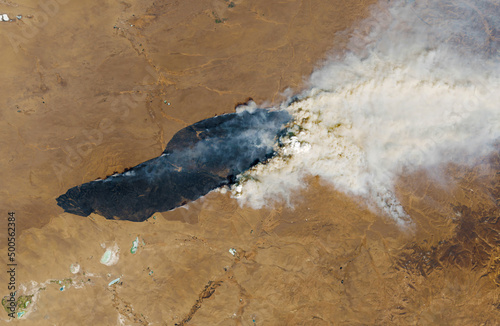 Satellite view of the wildfires. Deforestation, global warming and climate change concept.Elements of this image furnished by NASA. photo