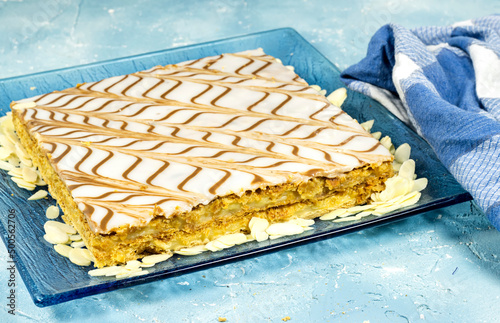 dessert named  in french mille-feuille with almonds  photo