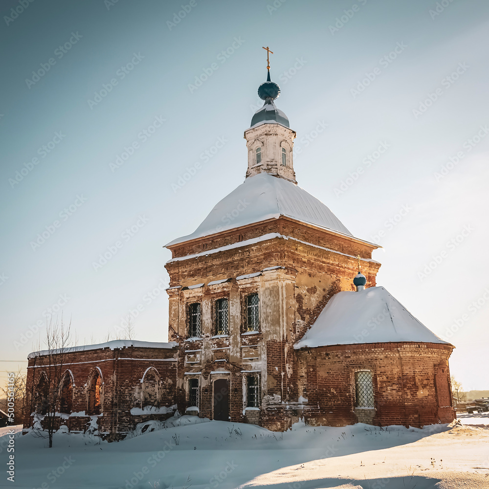 red brick village church in winter red brick village church in winter