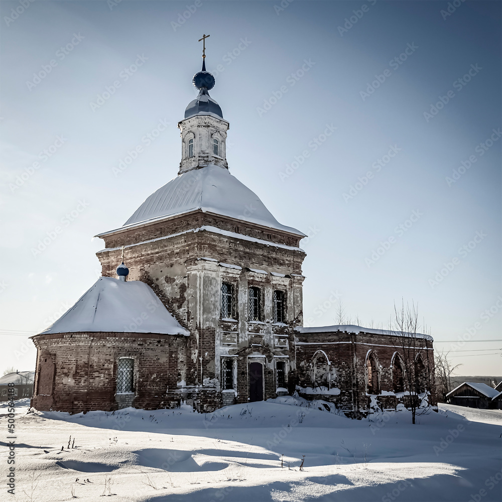 red brick village church in winter