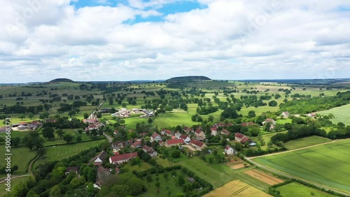 A traditional French village in the middle of fields and forests , in Europe, in France, in Burgundy, in Nievre, towards Nevers, in summer, on a sunny day. photo