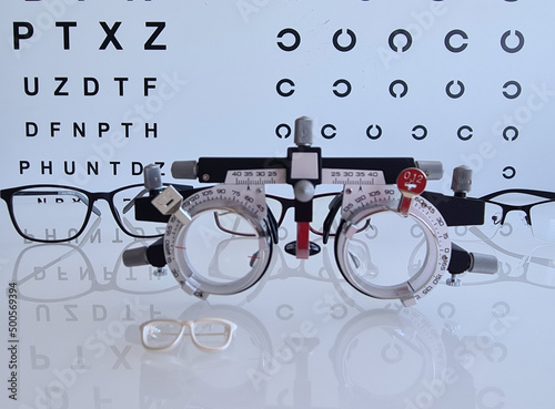 Glasses for checking eyesight by ophthalmologist and table photo