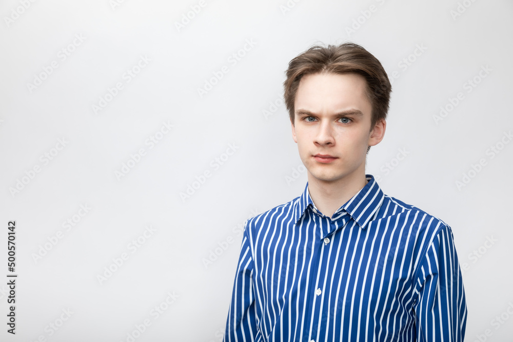 Skeptic teenager studio shot on gray background