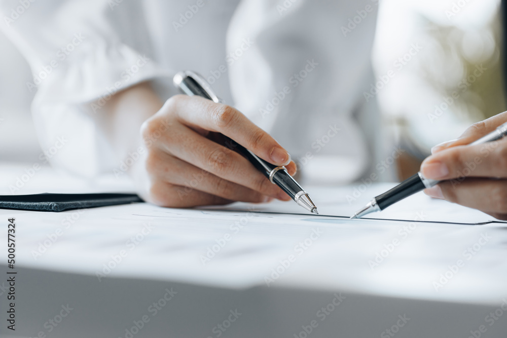 The sales department is having a monthly summary meeting to bring it to the department manager, they are verifying the correctness of the documents that are prepared before bringing in to the manager The sales department is having a monthly summary meeting to bring it to the department manager, they are verifying the correctness of the documents that are prepared before bringing in to the manager