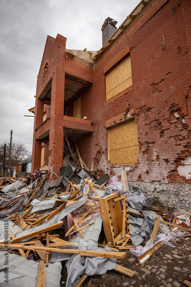 Fototapeta premium Bila Tserkva, Kyev region Ukraine - 04.03.2022: The consequences of an airstrike, a missile attack on residential buildings in Bila Tserkva. Russian troops destroy houses, people in Ukraine.