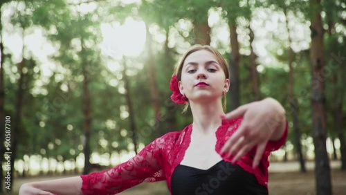 CLose up of young woman are dancing Traditional Spanish dance in summer forest