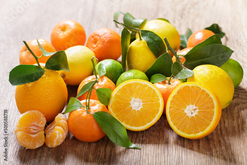 fresh citrus fruits on a wooden table