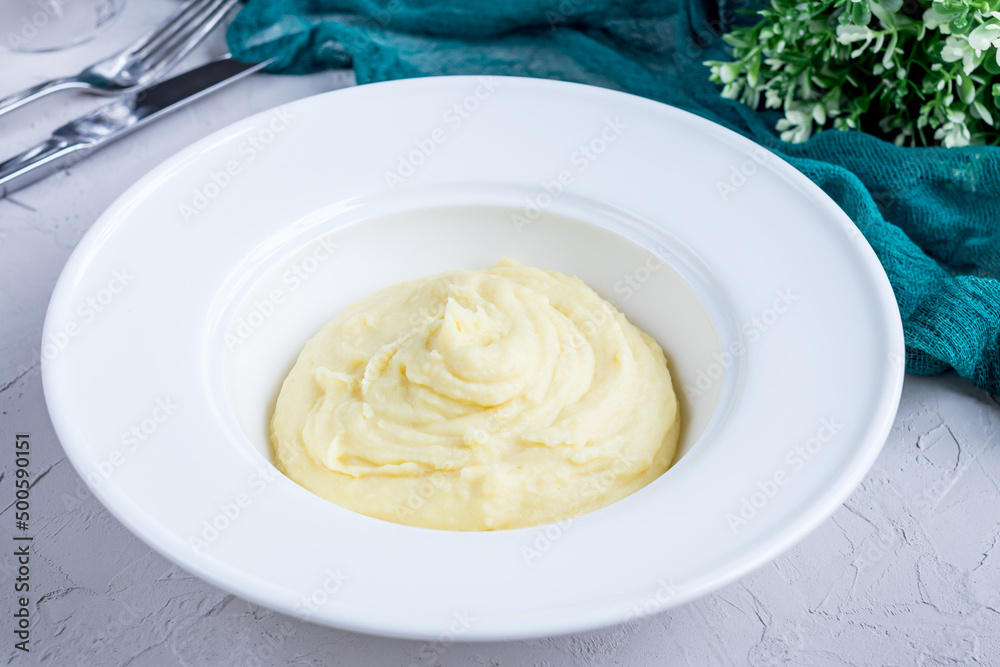 mashed potatoes on a white bowl on grey table mashed potatoes on a white bowl on grey table