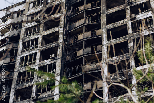 Mariupol, Ukraine - May 1, 2022: Russia's war in Ukraine. Damaged residential building photo