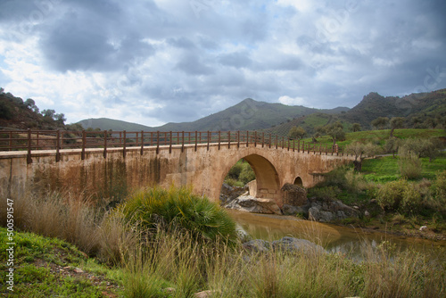 View of a very beautiful valley whit a nice bridge in Andalusia near Almogia, Spain photo