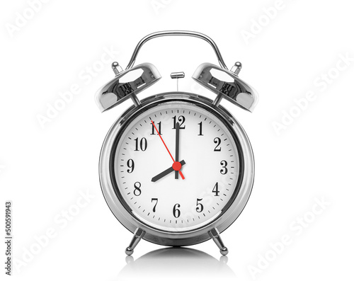 Alarm clock isolated on white background. Eight hours after midnight or noon. Twenty hours on the clock.