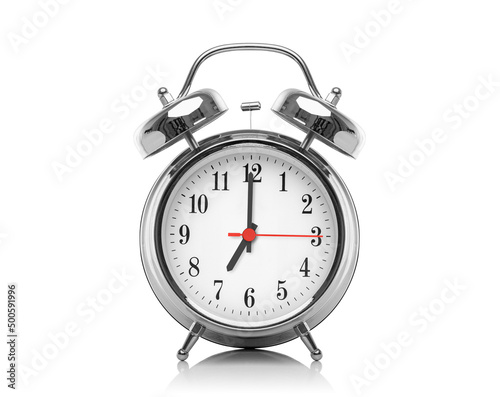Alarm clock isolated on white background. Seven hours after midnight or noon. Nineteen hours on the clock.