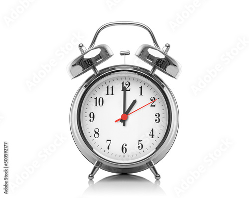 Alarm clock isolated on white background. The hour after midnight or noon. Thirteen hours on the clock.