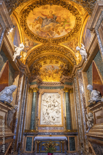 ROME, ITALY - SEPTEMBER 1, 2021: The baroque marble relief of Holy Family and blesed Ludovica Albertoni the in side chapel of church Chiesa di Santa Maria in Campitelli by Lorenzo Ottoni (1697-1705).