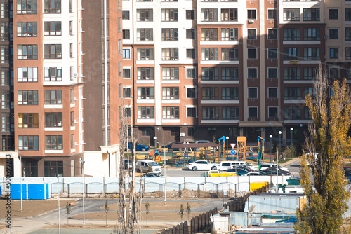 The architectural complex of residential buildings on sky background