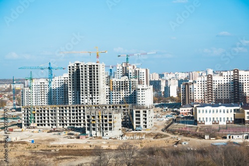 The architectural complex of residential buildings on sky background