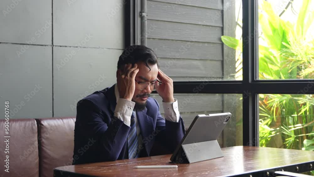 Businessman suffering from stress from congenital disease Businessman suffering from stress from congenital disease