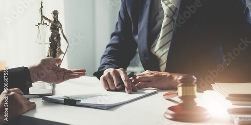 Photos Businesswoman and lawyer discuss the contract document