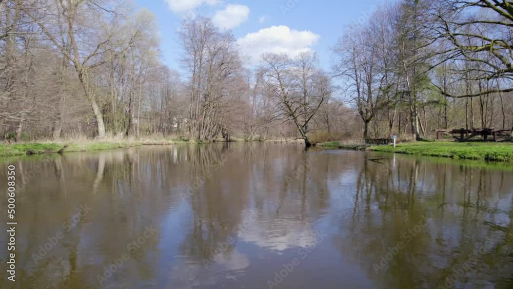 River, forest, natural environment from a bird's eye view in the morning. Low flying under trees, wildlife and nature in beautiful weather conditions. River, forest, natural environment from a bird's eye view in the morning. Low flying under trees, wildlife and nature in beautiful weather conditions.