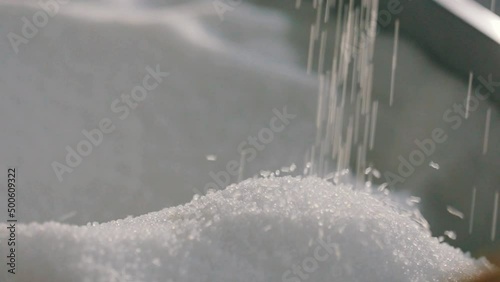 Falling polypropylene granules, slow motion. Polypropylene granules. Polypropylene granules close-up. Nonwoven Fabric Factory photo