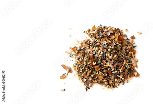 Dry mix of spices on a white table. Cilantro, pepper, cooking seasoning