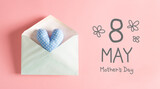 Mother's Day message with a blue heart cushion in an envelope