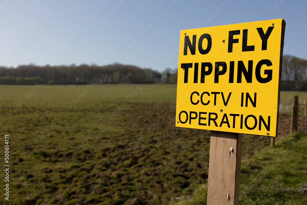 yellow no fly tipping sign