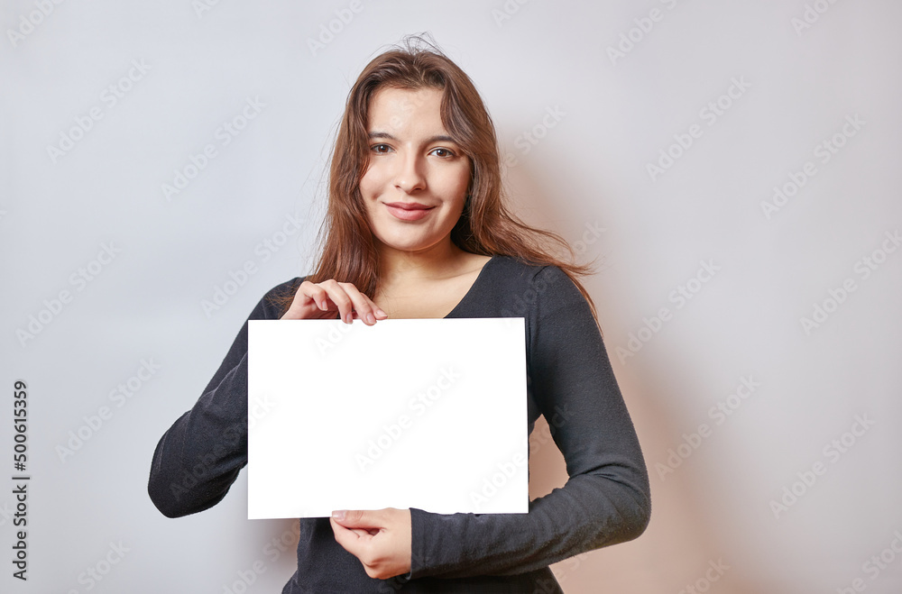 Pretty girl holding a banner, white billboard. Pretty girl holding a banner, white billboard.