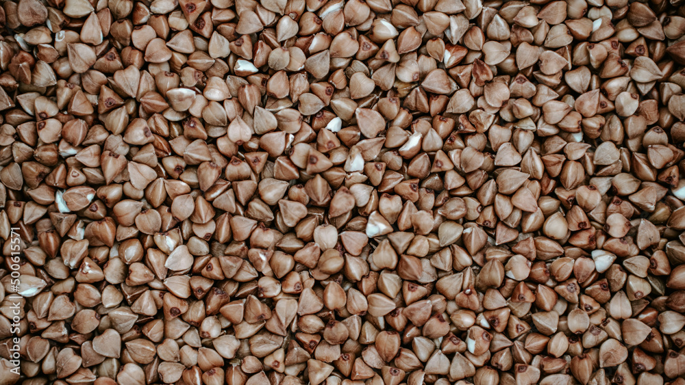 Close-up of buckwheat grains, buckwheat texture background. Natural healthy food, vegan diet Close-up of buckwheat grains, buckwheat texture background. Natural healthy food, vegan diet