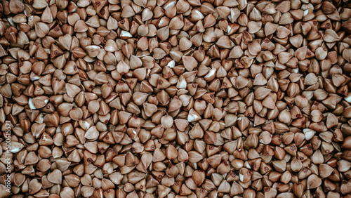 Close-up of buckwheat grains, buckwheat texture background. Natural healthy food, vegan diet