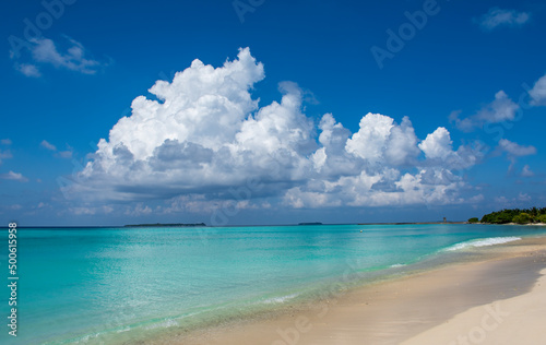Fototapeta Naklejka Na Ścianę i Meble -  Beautiful image of tropical beach image taken from Maldives beach, turquoise ocean with clear sand and  awesome clouds on the background