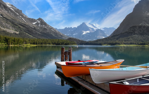 Colorful Canoes at Lake McDonald shore line in Glacier national park Montana.