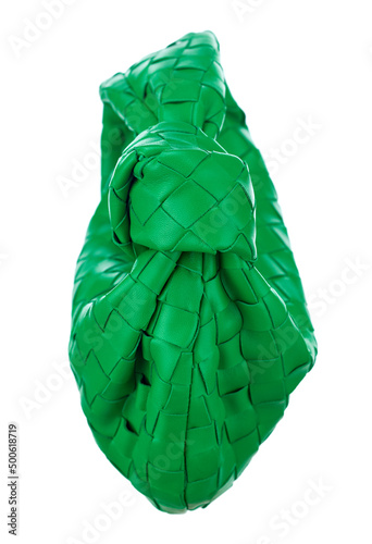 Gorgeous little handbag made of woven bright green leather, isolated on a white background. Side view. Expensive women's accessories.
