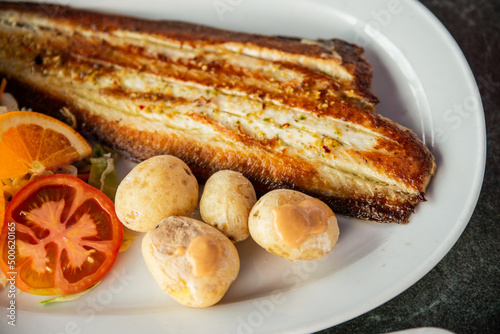 Tasty fried fish and sea fruits with potato traditional Canarias dish.