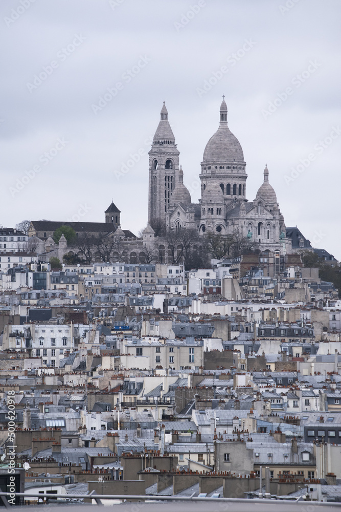 Paris, France, Europe: aerial view from the top of the Eiffel Tower with Montmartre hill, the highest point in the city, and Basilica of the Sacred Heart, Roman Catholic church completed in 1914
