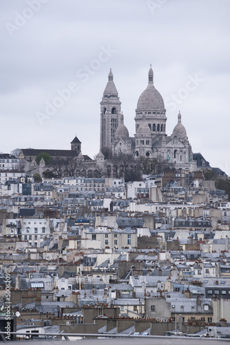 Paris, France, Europe: aerial view from the top of the Eiffel Tower with Montmartre hill, the highest point in the city, and Basilica of the Sacred Heart, Roman Catholic church completed in 1914 