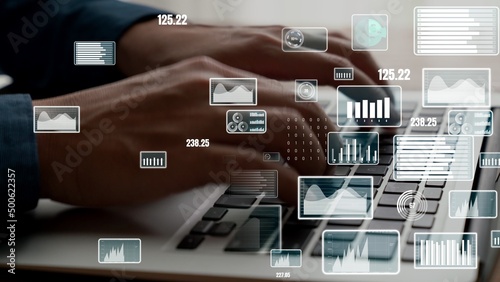 Businessman uses capable laptop computer to analyze business data analytic for marketing strategy and customer relationship management
