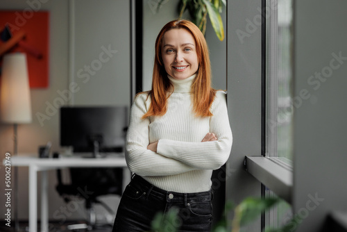 Wallpaper Mural 30s 40s business woman portrait. Successful modern executive in an office. Mid aged entrepreneur. Torontodigital.ca